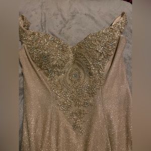 A sparkly gold prom dress